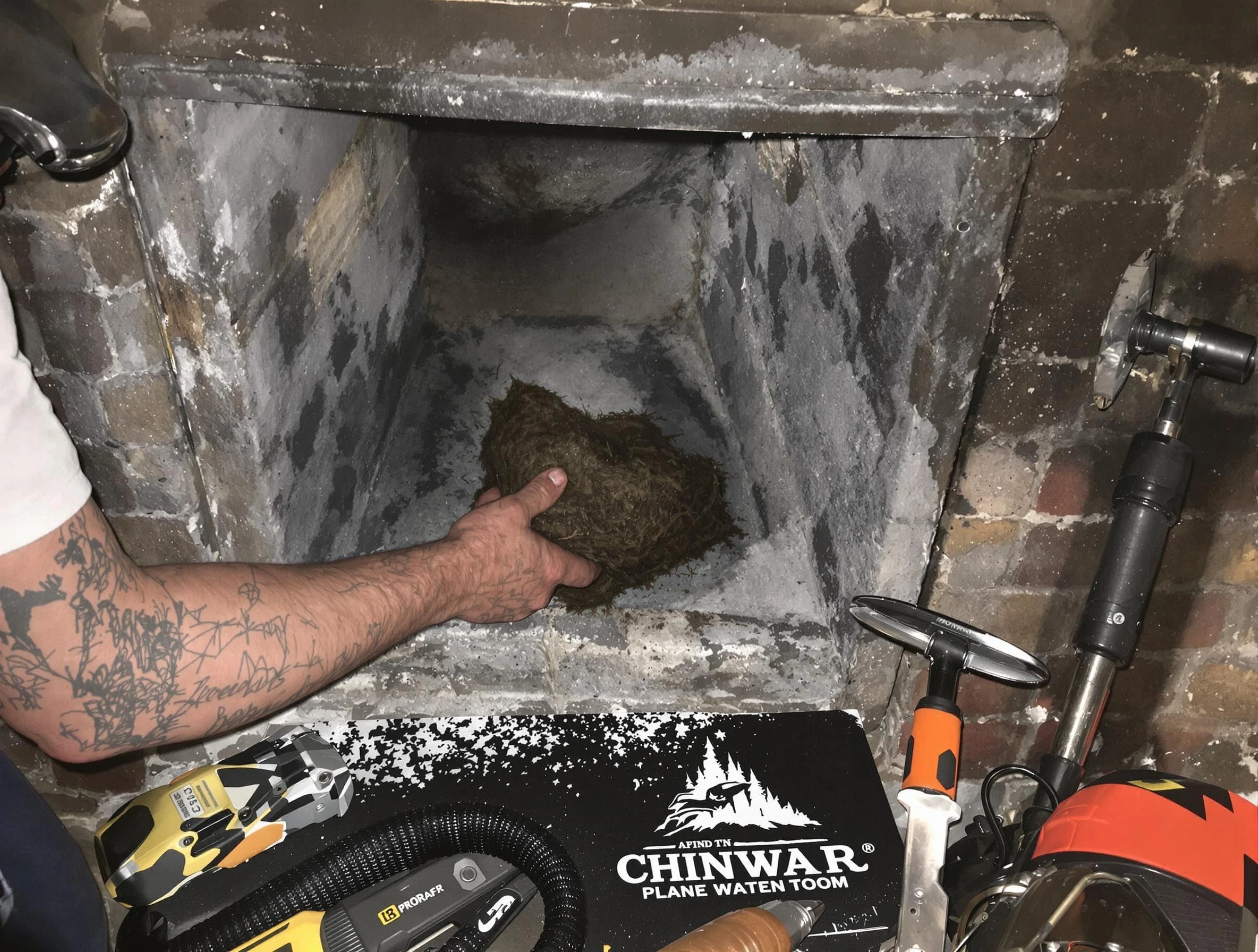 Chelmsford Chimney Sweep safely removing debris and screening chimney in Chelmsford, MA
